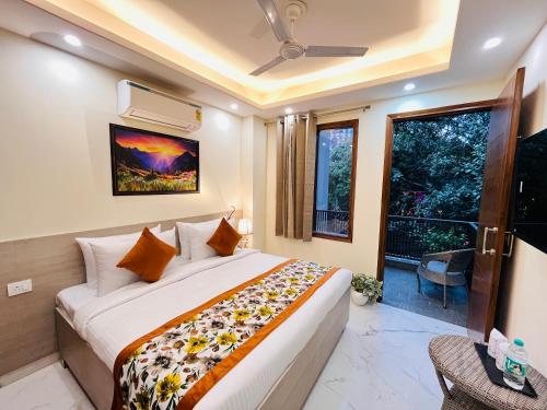 a bedroom with a large bed and a window at Hotel Ivaan Homes opposite to Iskcon Temple East of Kailash New Delhi in New Delhi