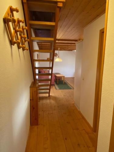a hallway with a spiral staircase in a house at Bärenhof Backhaus in Eisenbach