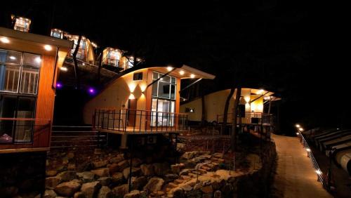 a building with a bunch of rocks in the dark at Goheung Tuttiamo Pension in Goheung