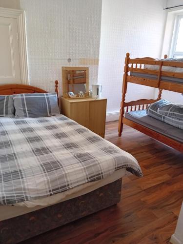 Katil atau katil-katil dalam bilik di Wishing Well Guest House