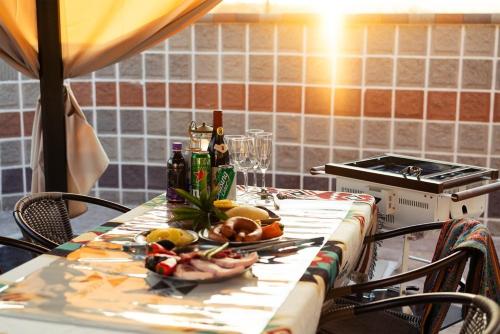 a table with a bunch of food and drinks on it at Gyeongju Yeonjeong Pool Villa in Gyeongju