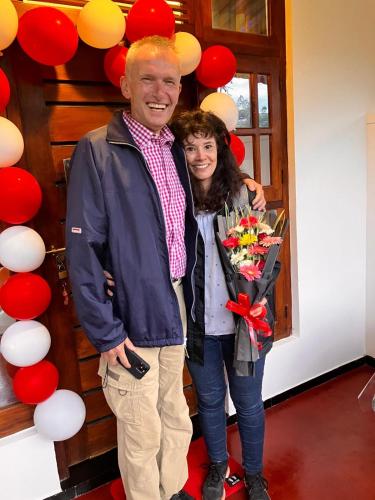 a man and a woman holding a bouquet of flowers at Forest Rawana homestay Ella in Ella