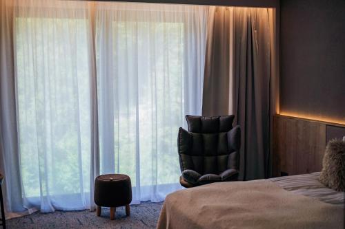 Katil atau katil-katil dalam bilik di Peakture Hotel Balvanyos