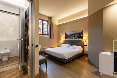 Postel nebo postele na pokoji v ubytování Relais Hotel Centrale "Dimora Storica"