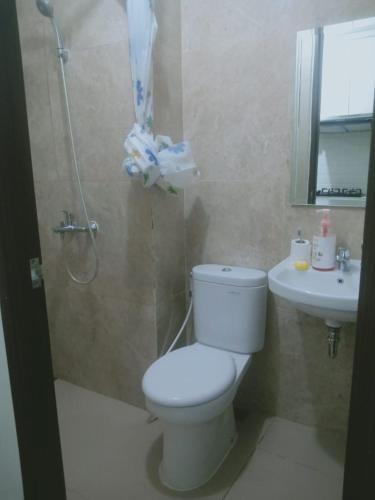 a bathroom with a toilet and a sink at Apartemen transpark cibubur by parvez 2 in Kalimanggis