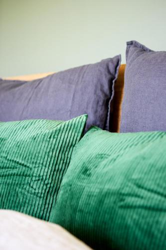 a group of pillows sitting on top of a couch at Hus154 Ferienhaus im Brandnertal in Bürserberg