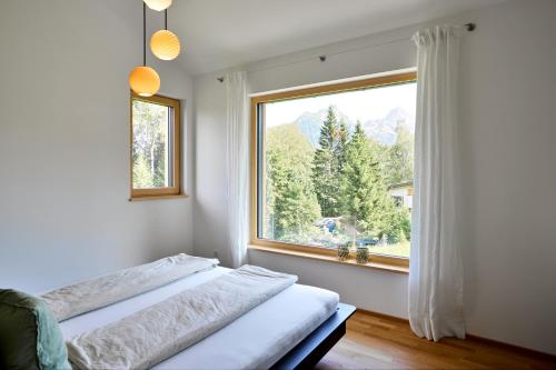 Postel nebo postele na pokoji v ubytování Hus154 Ferienhaus im Brandnertal