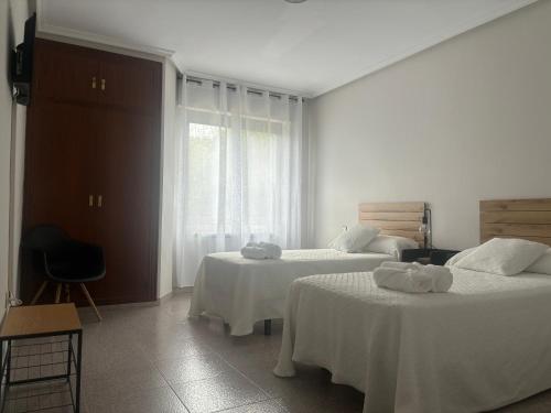 Postel nebo postele na pokoji v ubytování Hotel Juan Manuel