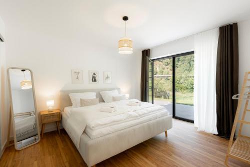 Ένα ή περισσότερα κρεβάτια σε δωμάτιο στο Luxuriöse Wohnung an der Lahn