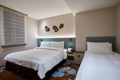 Postel nebo postele na pokoji v ubytování K Hotel Taipei II