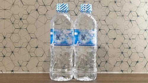 a bottle of water sitting on top of a table at Rosenheim Tokyo Shinjuku in Tokyo
