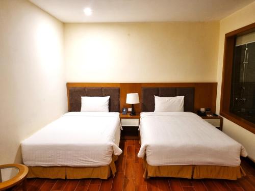 Ein Bett oder Betten in einem Zimmer der Unterkunft Muong Thanh Holiday Con Cuong