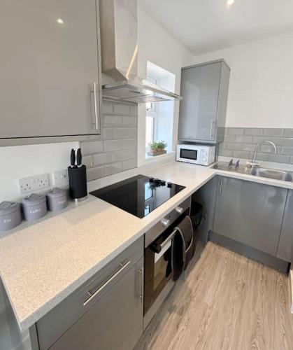 a kitchen with a sink and a counter top at Wellington Road Apartment 5 in Southtown