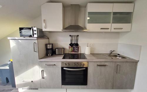 Kuchyň nebo kuchyňský kout v ubytování Gästehaus Veldhausen