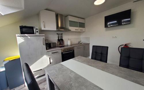 Kuchyň nebo kuchyňský kout v ubytování Gästehaus Veldhausen