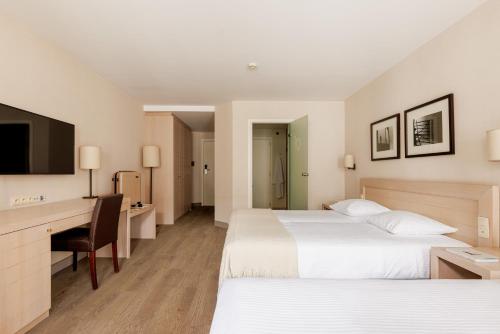 Ein Bett oder Betten in einem Zimmer der Unterkunft Hotel Aazaert by WP Hotels