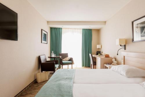 Ein Bett oder Betten in einem Zimmer der Unterkunft Hotel Aazaert by WP Hotels
