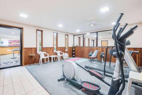 a fitness room with treadmills and a gym at Days Inn by Wyndham Sturgis SOUTHDAKOTA in Sturgis