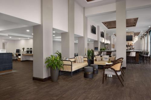 a large lobby with couches and chairs and tables at DoubleTree by Hilton St. Augustine Historic District in Saint Augustine