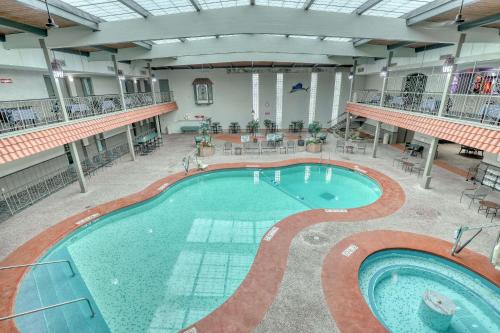 a large swimming pool in a large building at Quality Inn & Suites Green Bay Downtown in Green Bay