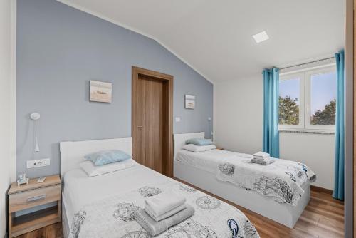 Postel nebo postele na pokoji v ubytování Holiday House Brig