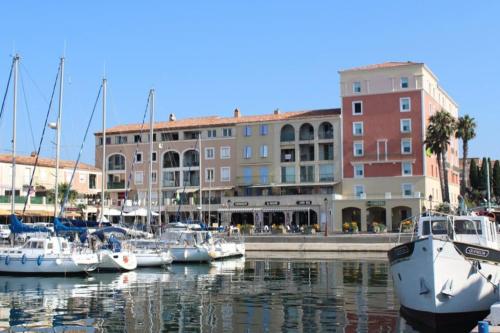 a group of boats are docked in a marina at Appartement Les Terrasses du Port in Port-de-Bouc