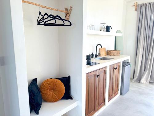 a small kitchen with a sink and a counter at COCCOLOBA in Holbox Island