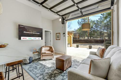 a living room with a couch and a table at Pinewood Sanctuary Secluded & Peaceful OCC Oasis in Colorado Springs