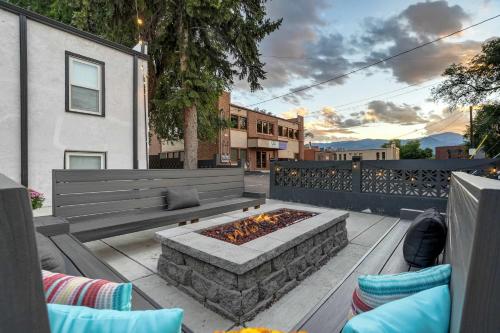 a patio with a bench and a fire pit at Pikes Escape - Downtown Workcation 4K Roku in Colorado Springs