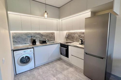 Kuchyň nebo kuchyňský kout v ubytování Cozy Apartment in Central Varna