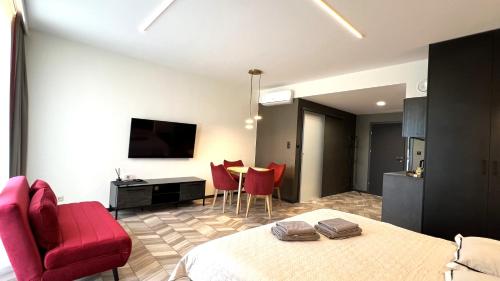 Televízia a/alebo spoločenská miestnosť v ubytovaní BUNASTA Apartments