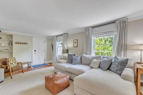a living room with a couch and a table at Newly Renovated Carriage House in Hillsborough