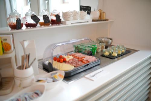 a tray of food on a counter in a kitchen at Hotel Adler am Schloss in Bönnigheim