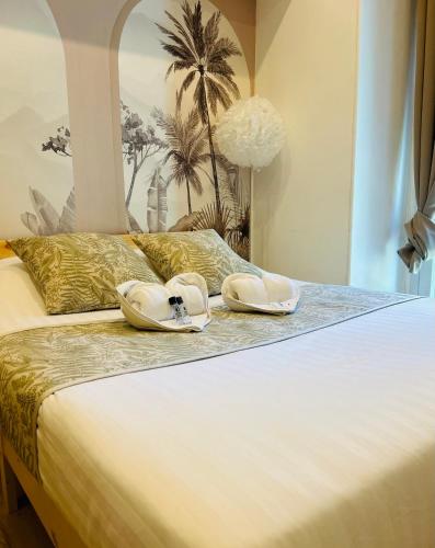 Katil atau katil-katil dalam bilik di Hotel Les Orangers