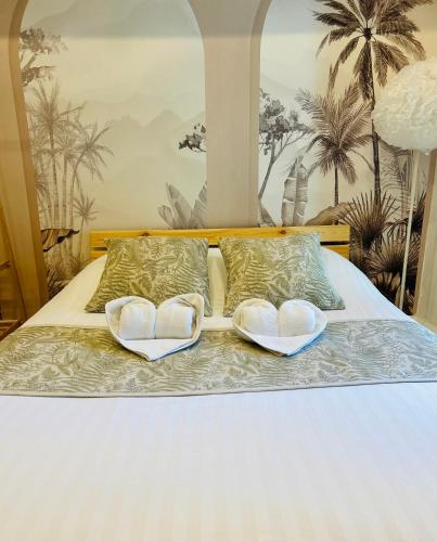 Katil atau katil-katil dalam bilik di Hotel Les Orangers