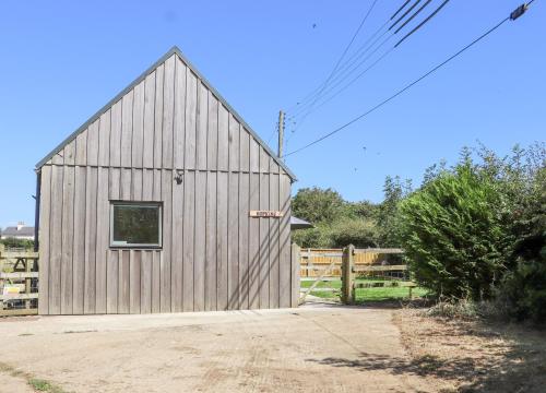 a barn with a window on the side of it at Hopkins at The Homestead in Dover