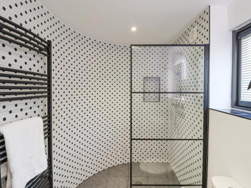 a shower with a glass door in a bathroom at Hopkins at The Homestead in Dover