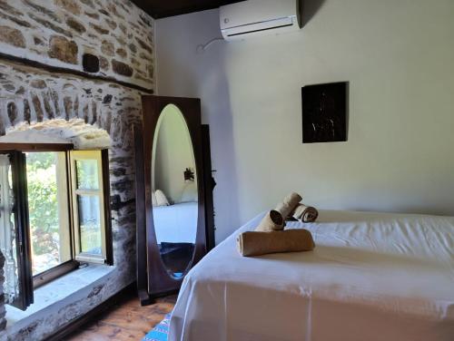 Postel nebo postele na pokoji v ubytování Μountain Whispers
