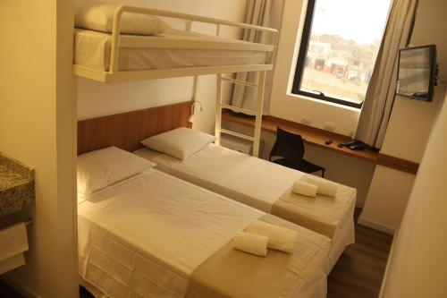 Postel nebo postele na pokoji v ubytování Centro Sul Express Hotel