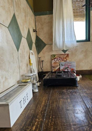 a room with a bed and a table in a room at El Atelier - Valle de Uco in La Consulta