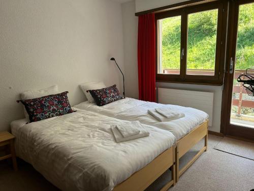 Ένα ή περισσότερα κρεβάτια σε δωμάτιο στο MP24 Ski in, out apartment on slopes with indoor private parking space