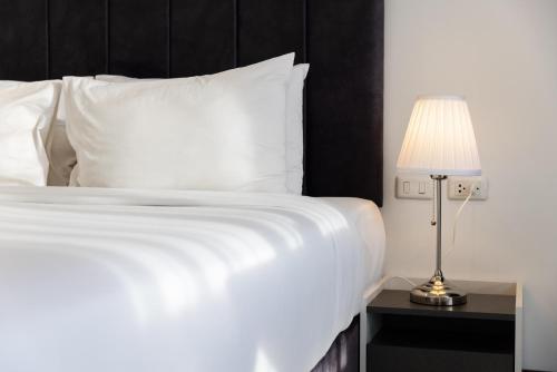 Katil atau katil-katil dalam bilik di AMIRI PLACE HOTEL