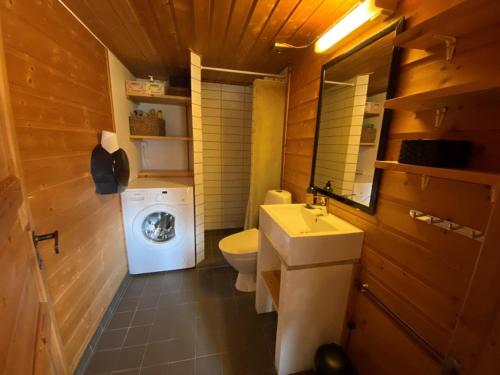 a small bathroom with a toilet and a sink at Sørlia hytte in Hafjell