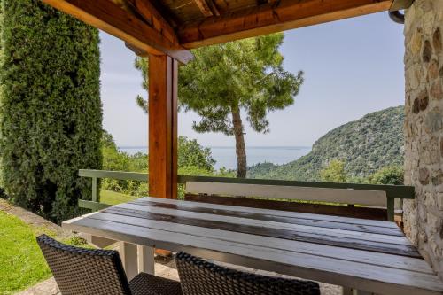a wooden bench sitting on top of a table at Residence San Michele in Costermano sul Garda