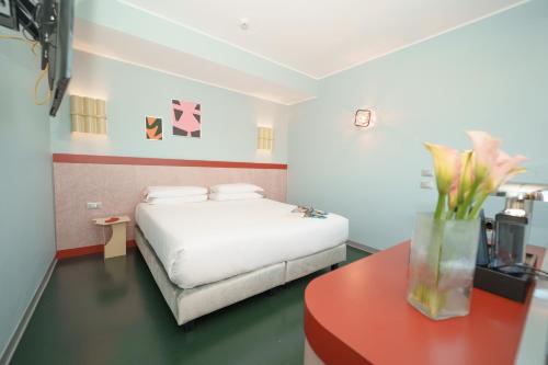 Postel nebo postele na pokoji v ubytování Moderno Hotel Roma