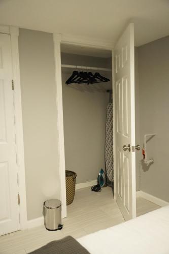 a room with a door and a hallway with a room with a door at Cozy 2 Bedroom In A Lovely Forest Hills Neighborhood in Parkside