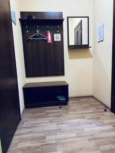 a room with a bathroom with a closet and a floor at Etna Hotel in Lviv