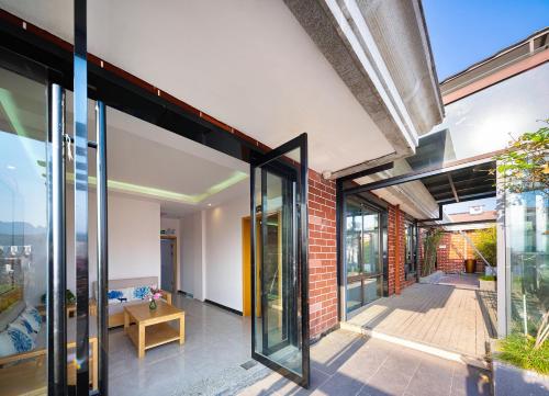 an internal view of a house with sliding glass doors at Zhangjiajie DreamWay Hotel - Free pick up service in Zhangjiajie