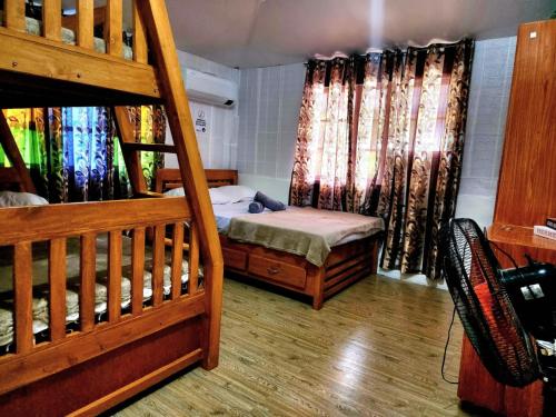 a bedroom with two bunk beds and a staircase at 3 Bed House - Sleeps 20 - Pets - Pool - Garden in Caba