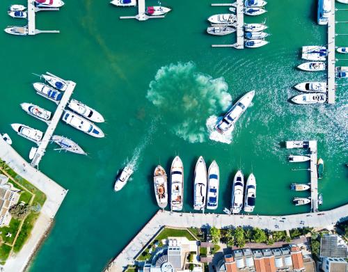 an aerial view of a marina with boats in the water at Sani Club in Sani Beach